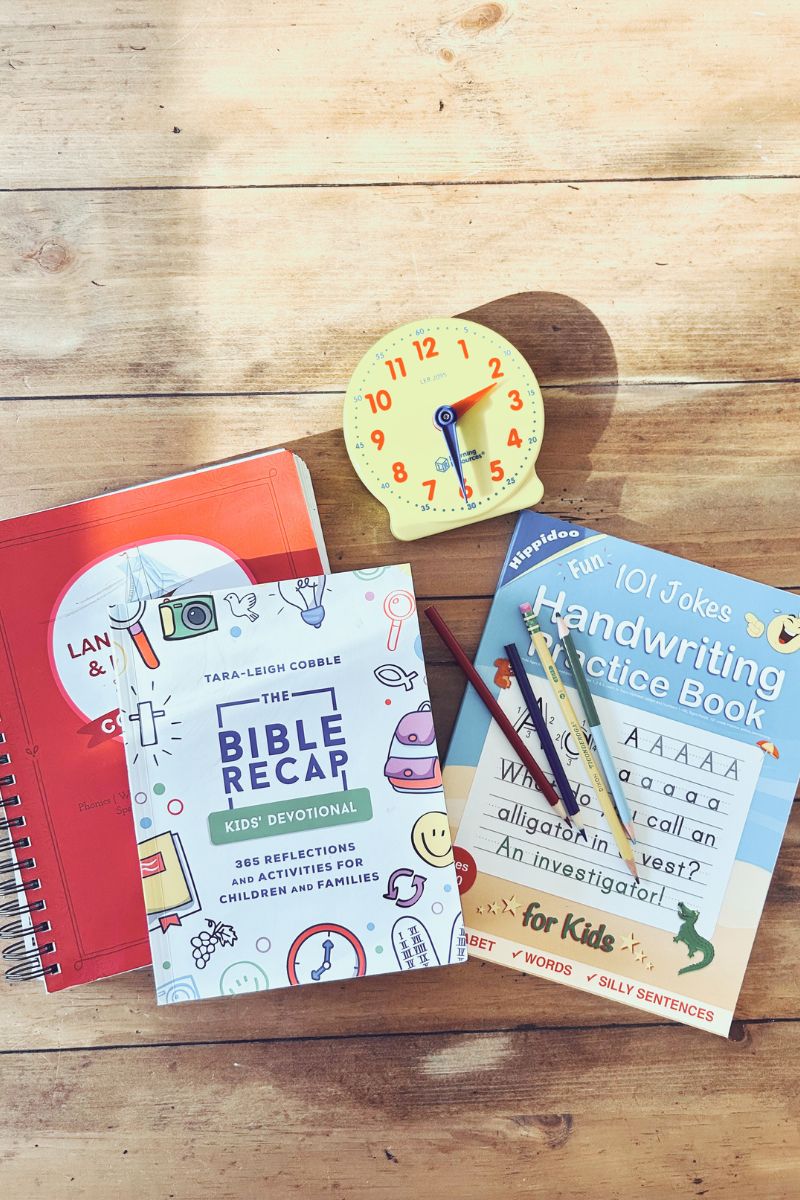 Homeschool curriculum and supplies on a table